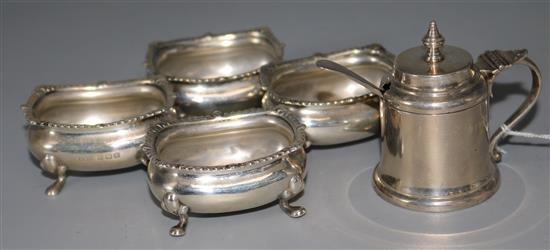 A set of four silver salt cellars and a silver mustard pot.